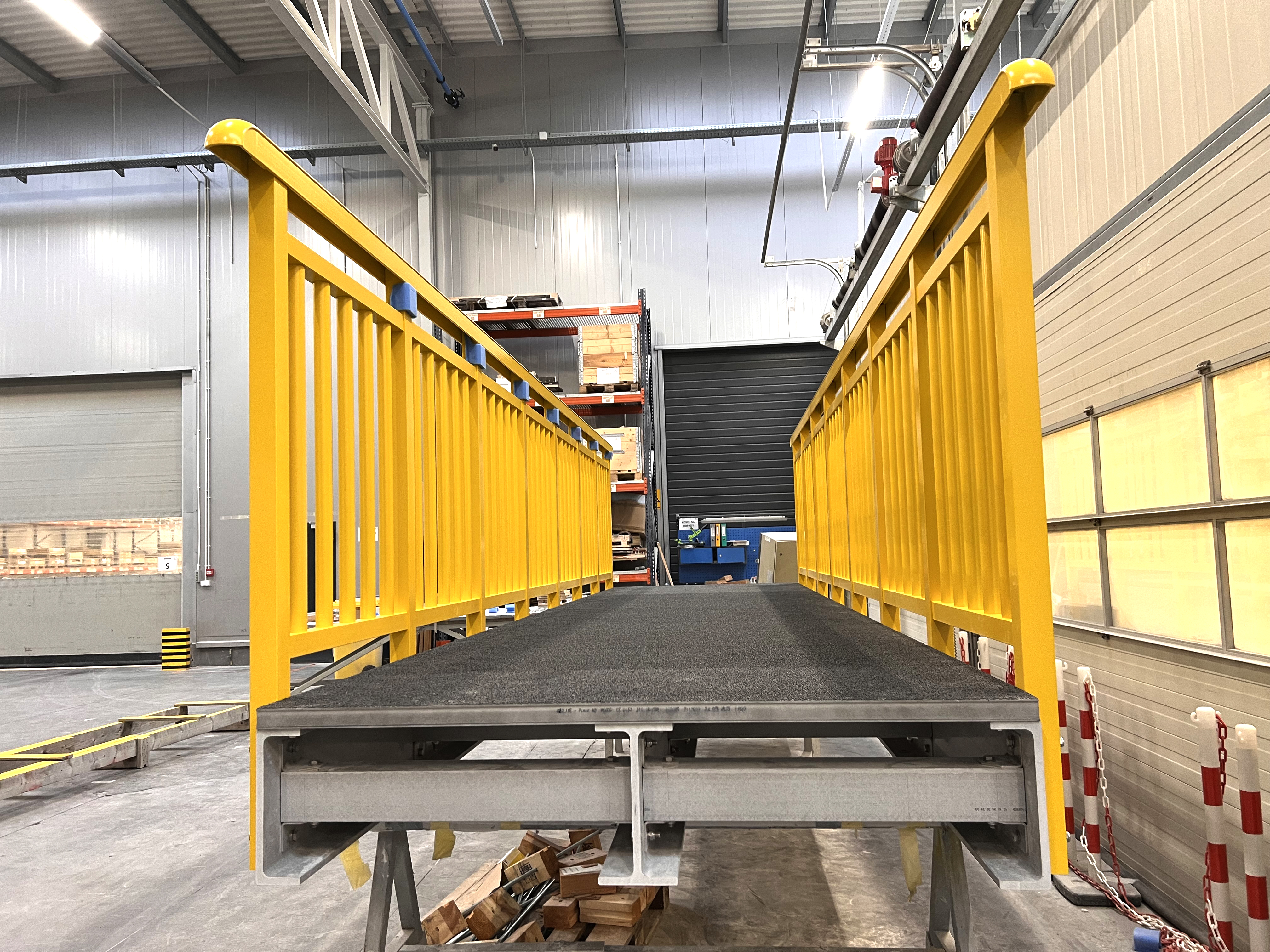 Yellow GRP square tube used as a baluster in a Fiberline handrail system