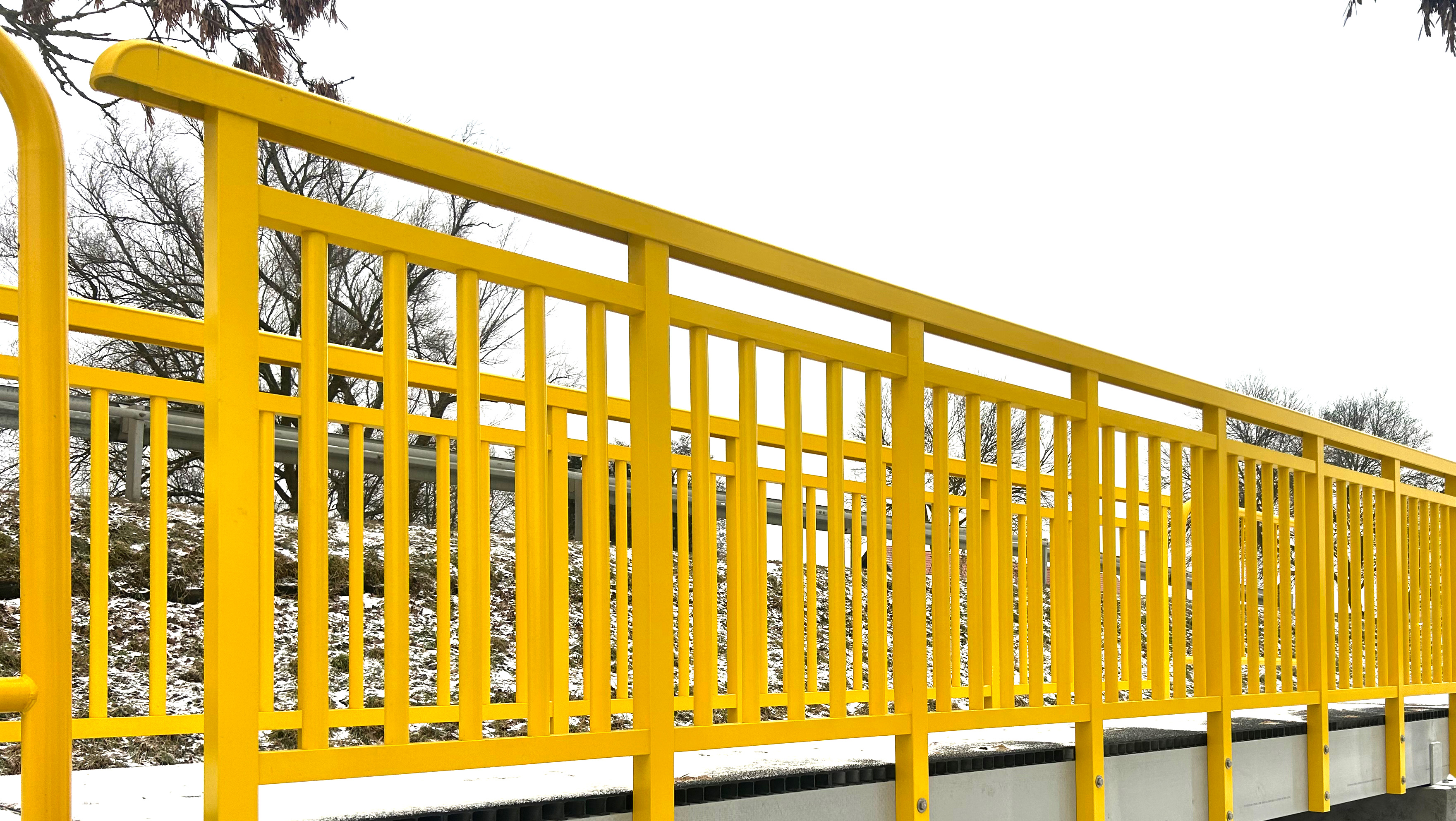 Yellow GRP square tube used as a baluster in a Fiberline handrail system
